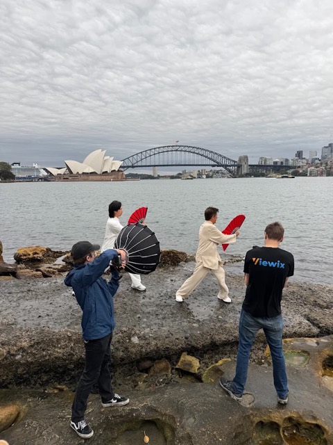 Viewix crew filming performers in front of the Sydney Opera House and Harbour Bridge