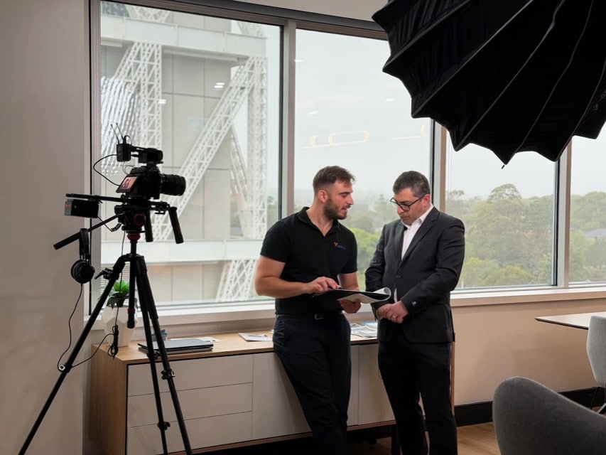Viewix camera operator filming an office interview