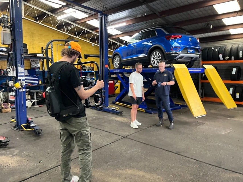 Viewix crew filming in an automotive workshop
