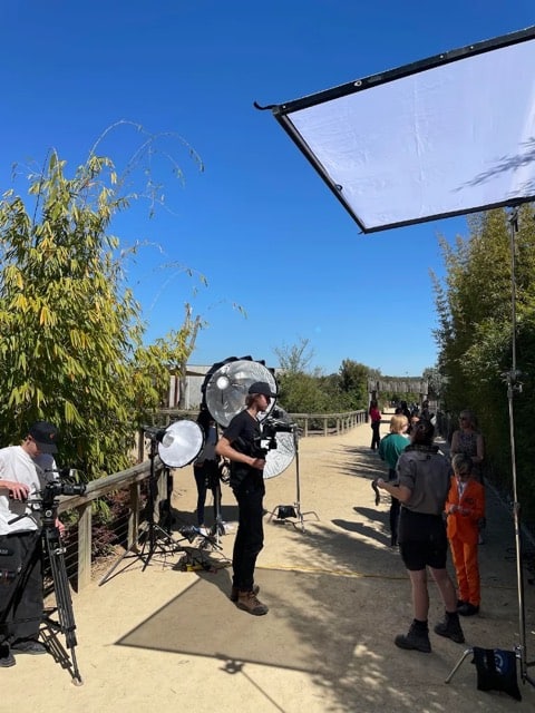 Viewix crew setting up lighting for an outdoor shoot